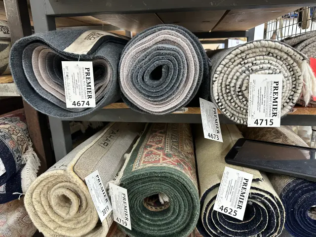Clean rugs rolled and tagged for return delivery
