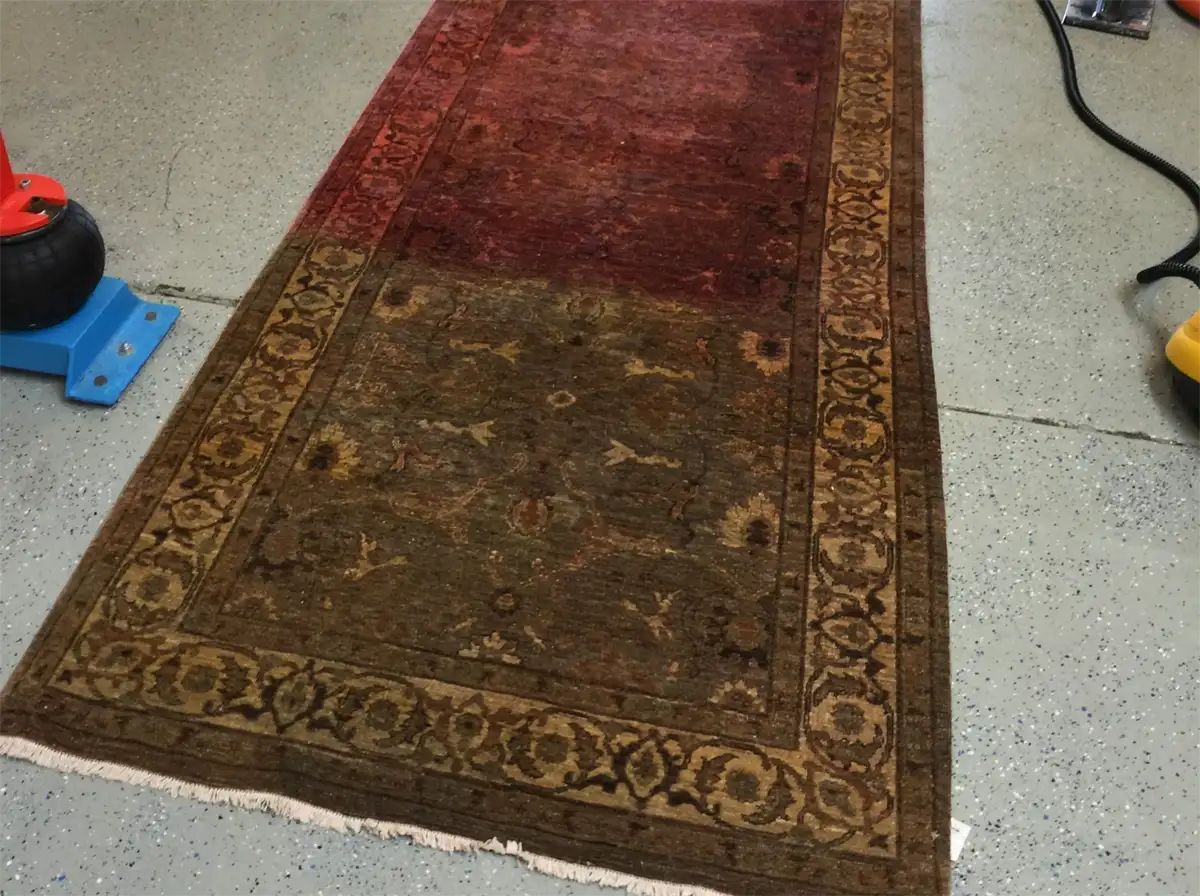 Wool runner partway through correction after its red dye ran from getting wet
